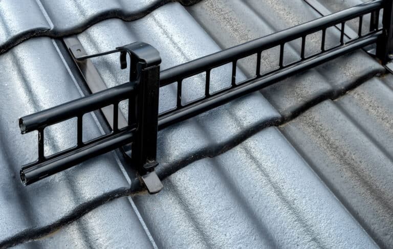 Tiles roof with snow guard safety. Close up